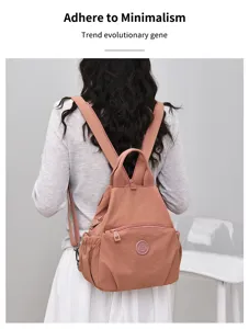 Waterproof nylon casual backpack for women, lightweight travel daypack with front pocket.
