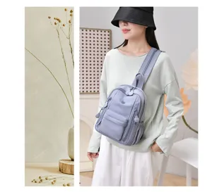 Mini nylon backpack for women, lightweight waterproof multi-pocket casual sling shoulder bag.