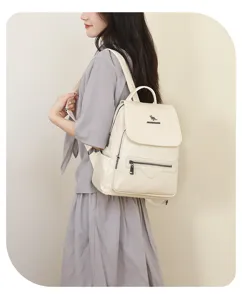Elegant casual women's backpack in beige pu leather with multi-pocket design for daily travel.