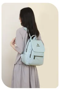 Stylish light blue leather backpack for women, perfect casual daily use and travel storage.