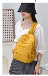 Stylish nylon casual backpack for women, waterproof large capacity daily commute school bag.