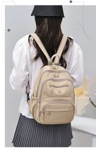 Nylon casual backpack with multi pockets and waterproof design for women daily commute.