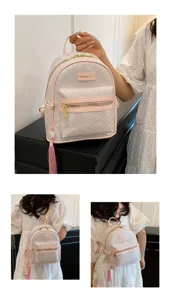 Women's mini backpack, embossed nylon material, pink trim with cute tassel pendant.
