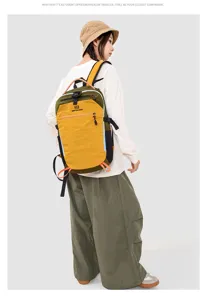 Multifunctional outdoor hiking backpack with large capacity, stylish two-tone design for travel.