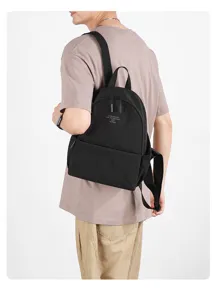 Casual nylon backpack for daily use, lightweight travel school bag with simple design in black.