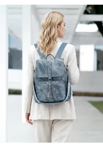Vintage washed fabric backpack for women featuring ethnic woven strap, detailed view.