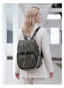 Vintage washed fabric backpack for women, large capacity travel bag with ethnic style strap.