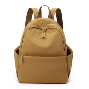 Washable nylon backpack for women, casual travel school book bag in khaki, front pocket.