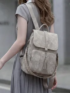 Vintage washed fabric backpack for women, large capacity travel bag with ethnic woven strap.