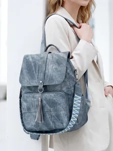 Vintage washed fabric backpack for women, large capacity travel bag with ethnic woven strap.