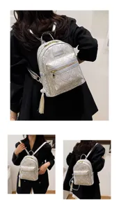 Detailed view of the women mini nylon backpack featuring elegant embossing, tassel and zipper.