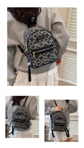 Mini black patterned nylon backpack for women with tassel and zipper daily casual style.