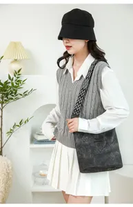 Stylish soft leather bucket shoulder bag with wide geometric strap for women daily casual wear.