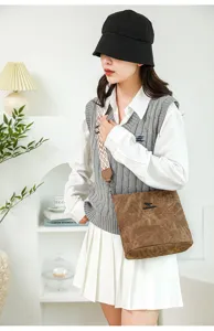 Stylish soft leather bucket bag with wide strap, trendy women's cross-body shoulder bag for daily use.