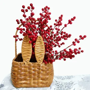 Artificial red berry bouquet in woven basket, perfect for New Year floral decor and festive gifts.