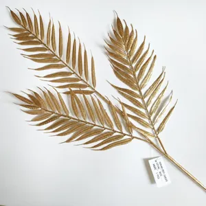 Gold artificial fern leaf branch, detailed texture, perfect for home decor and holiday arrangement.