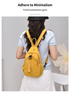 Detail view of stylish yellow nylon convertible backpack chest bag with multiple compartments.