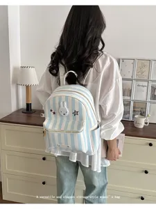 Blue and white striped backpack with cute bunny patch, stylish casual commuter daily bag.