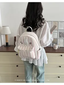 Cute pink and white striped backpack with rabbit patch, stylish casual daypack for women.