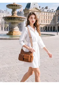 Vintage soft leather multi-pocket crossbody shoulder bag for women with wide strap for commuting.