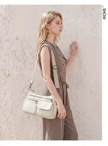 Retro soft leather multi-pocket shoulder bag with wide striped webbing strap for women commute.