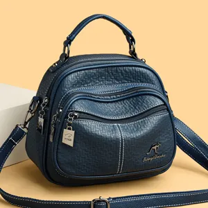 Stylish women's convertible backpack handbag in dark blue textured leather with multiple pockets.