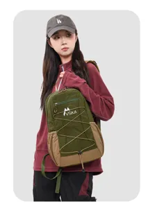Detailed shot of the stylish color-block sports backpack carried by model in casual scene.