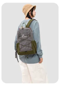 Detail view of the color-blocked casual backpack featuring side mesh pockets and straps.