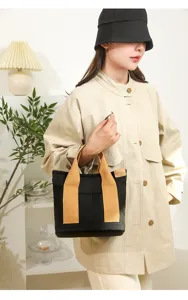 Japanese style black canvas tote bag, durable fabric with brown handles, daily casual handbag.