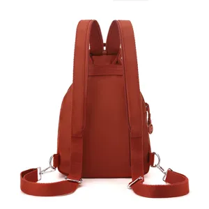 Casual nylon convertible backpack for women, minimalist rust red daypack with multi-pockets.
