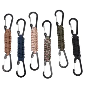 Close-up of handmade paracord keychain with dual carabiner hooks in assorted colors