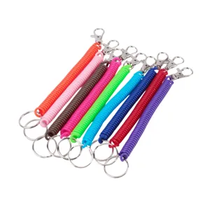 Close-up of colorful plastic spring coil keychains featuring metal lobster clasps.
