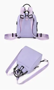 Detailed close-up view of the purple mini convertible backpack showing multiway straps and zipper.