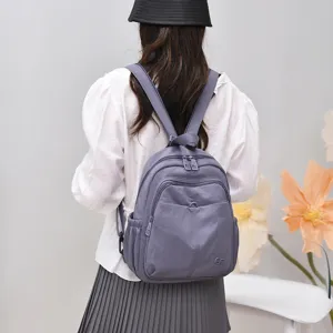 Stylish nylon backpack for women, lightweight commuting school bag with multi-compartments.