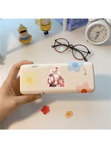 Cute Christmas Santa storage box detail view, pastel floral design desktop organizer case.