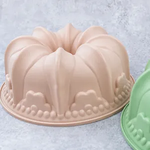 Close up of food grade silicone cake baking mold detail, pink fluted crown design texture