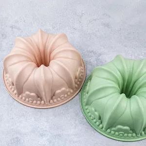 Silicone cake mold fluted bundt baking pan kitchen tool pink and green color set for home use.