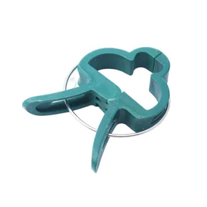 Green plant clips for garden support, tomato flower fixing, durable plastic support clips.