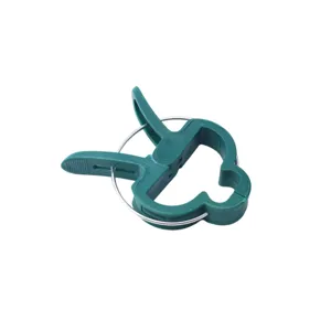 Green plastic garden plant fixing clips detail shot, perfect for supporting tomatoes and flowers securely.