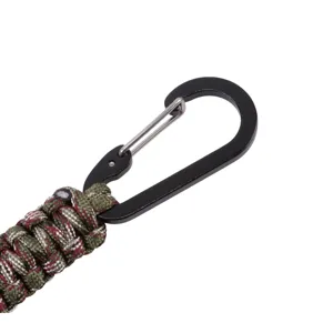 Closeup detail of handmade paracord keychain with black metal carabiner clip outdoor gear.