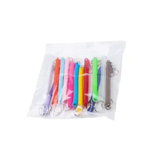 Colorful spring coil keychains with metal rings and clips packed in a transparent bag.