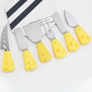 Stainless steel cheese knife set detail view featuring cute yellow cheese block shaped handles.