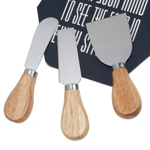 Stainless steel cheese knife set with rubber wood handles, detail view of three spreaders.
