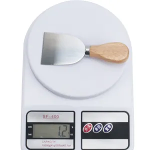 Stainless steel cheese knife with wooden handle for baking kitchen and butter spreading.