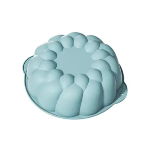 Silicone cake mold for baking, shell flower shape, food grade, non-stick, light blue color.