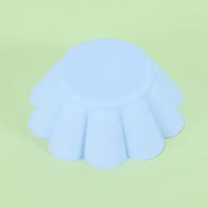 Light blue silicone muffin cup mold, petal shaped baking tool for kitchen and soap making.