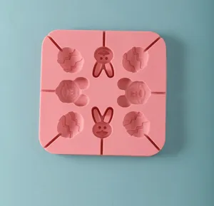 Pink silicone lollipop mold square chocolate baking tool with cute cartoon shapes and egg designs.
