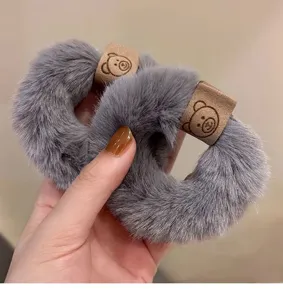 Fluffy gray hair scrunchies with cute bear leather patch, soft plush ponytail holder accessories.