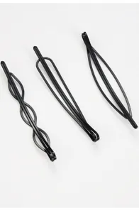 Detailed close-up shot of minimalist black metal geometric hair clips, sleek and modern design.