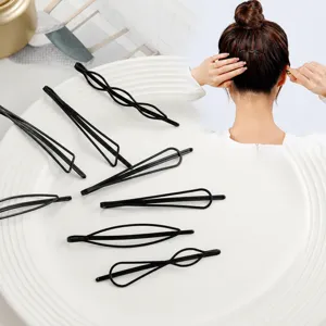 Minimalist geometric black metal hair clips for styling bangs and flyaways securely.